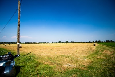 Green grass fields under the blue sky during the day
